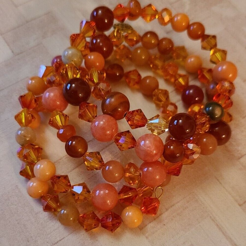 Shades of orange plastic bead coiled wire bracelet fashion jewelry